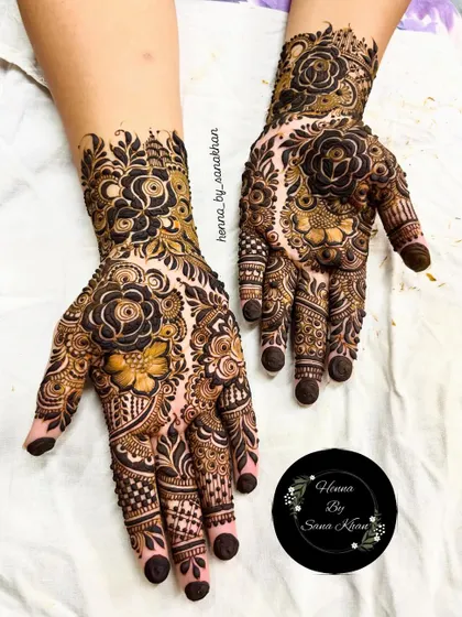 A dense and dark floral design that makes a statement. The use of negative space makes the rose motifs pop, creating a dramatic and beautiful effect.