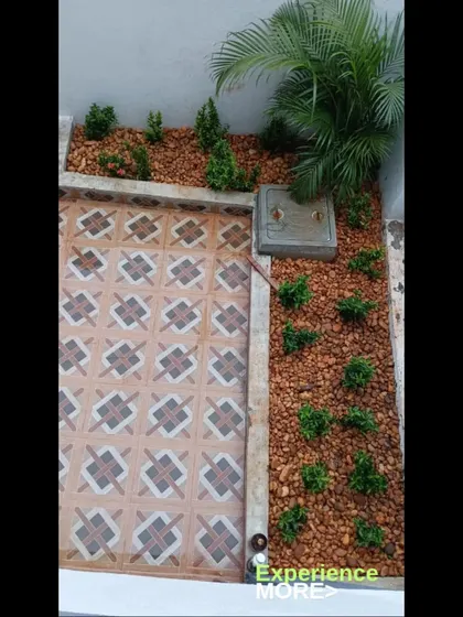 A complete look at the patio-side pebble garden, showing how it neatly fits into the corner of the property.