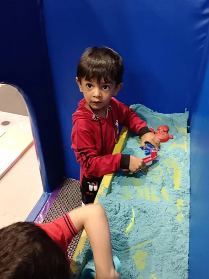 Focused on fun in the sand pit. We use kinetic sand, which is mess-free and perfect for sensory play, allowing kids to mold and build with ease.
