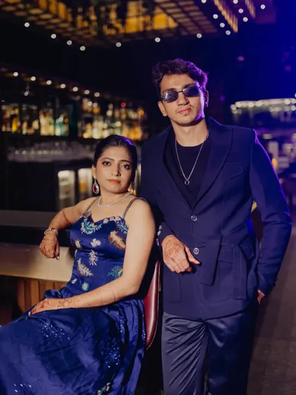 A cool and confident couple portrait from their cocktail night. The lighting and their poses give this shot a modern, almost editorial feel.