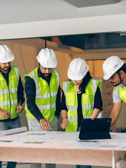 Collaboration is key at every stage. Here, our project managers and engineers are reviewing blueprints on-site, ensuring every detail is executed according to plan.