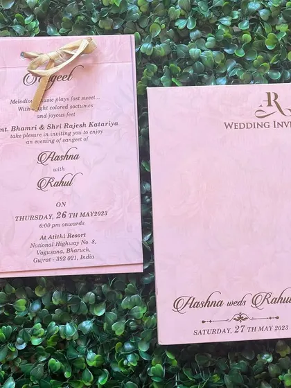 A beautiful pink invitation with a laser-cut floral panel. The design is soft, romantic, and perfect for a modern wedding.