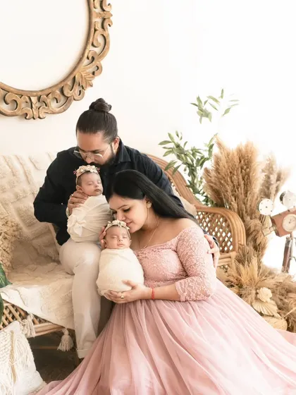 Twice the blessings! A beautiful family portrait with newborn twins. We are experienced in safely and beautifully posing multiples for their first photoshoot.