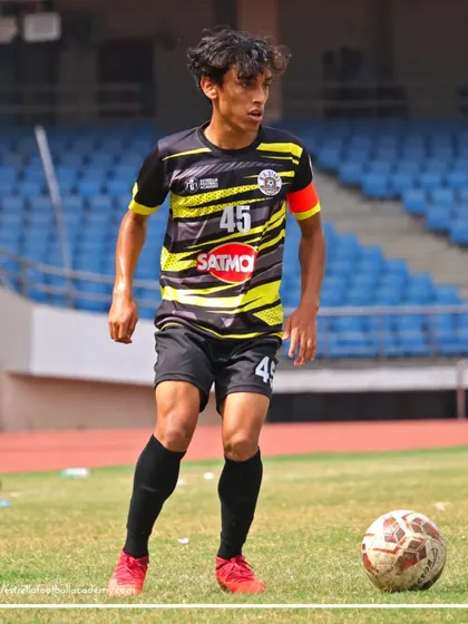 Our team captain, wearing number 45, looks on during a B Division match. Leadership is a quality I work to develop in all my players.
