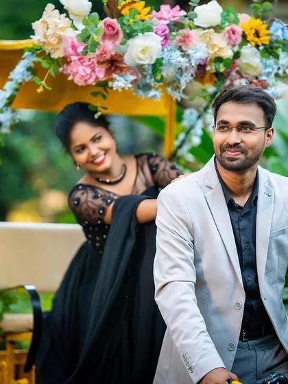A playful and fun shot of a couple with a decorated rickshaw, adding a unique and colorful element to their pre-wedding album.