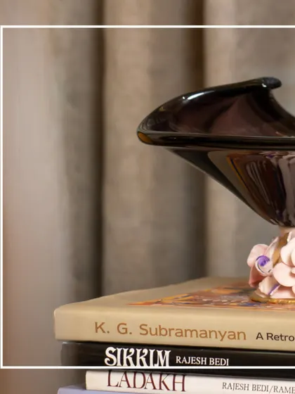 Elevate your interiors with a piece from my Murano Collection. This artistic glass bowl, resting on a stack of books, shows how luxury decor can add character and depth to your home.