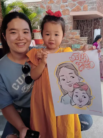 A lovely mother-daughter duo from Korea with their caricature. Art truly has no language barrier and brings smiles to people from all over the world.