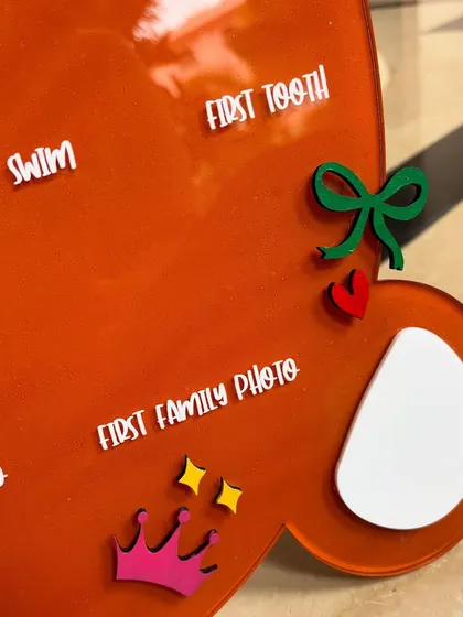 Zooming into the magic of the teddy bear milestone board. This project involved 3D cutouts, a scalloped banner with the baby's initial, and UV printing on an acrylic base, a new technique I was excited to try.