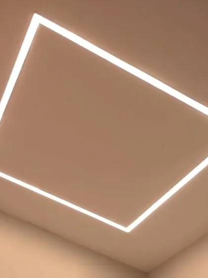 A large, square-shaped profile light installed flush with the ceiling, providing a clean, minimalist, and powerful source of illumination.