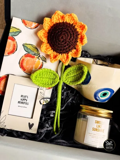 A sunshine and evil eye themed hamper, showing how we combine different personal themes into one cohesive and beautiful gift.