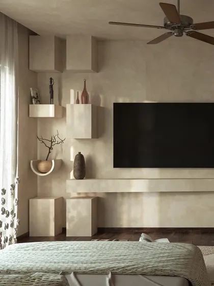 The TV wall features sculptural, block-like shelves, adding a raw, organic aesthetic. The entire space is designed to slow the senses and create a sanctuary of calm.