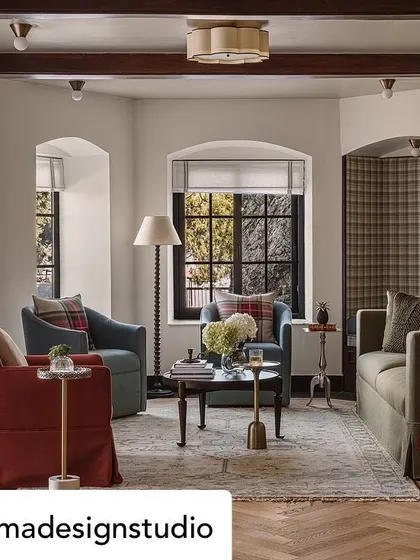 Another view of the Mussoorie estate, showing how we created multiple cozy seating areas within one large living space. The use of plaid, warm colors, and classic furniture forms contributes to the warm, inviting feel.