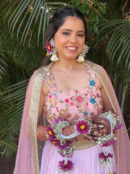 The bride looks radiant and happy, ready for her Haldi celebrations.