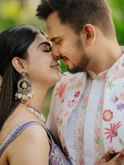 An intimate close-up, nose-to-nose, capturing the quiet connection between the bride and groom.