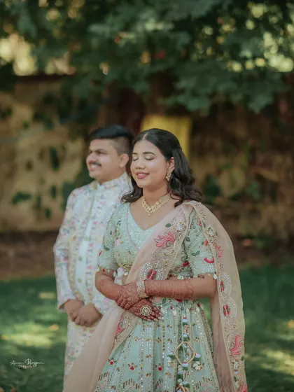 A serene portrait of the couple in a garden. The soft, natural light and their calm expressions create a beautiful and timeless image from their engagement.