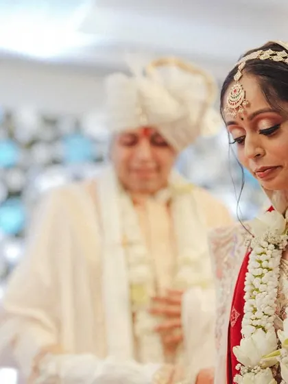 A portrait of the bride during the ceremony, her expression serene and thoughtful.