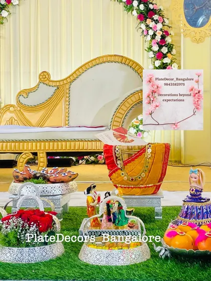 A closer view of a seer varisai setup, showing how I arrange different elements like decorated sarees, fruit baskets, and doll platters on silver stands.