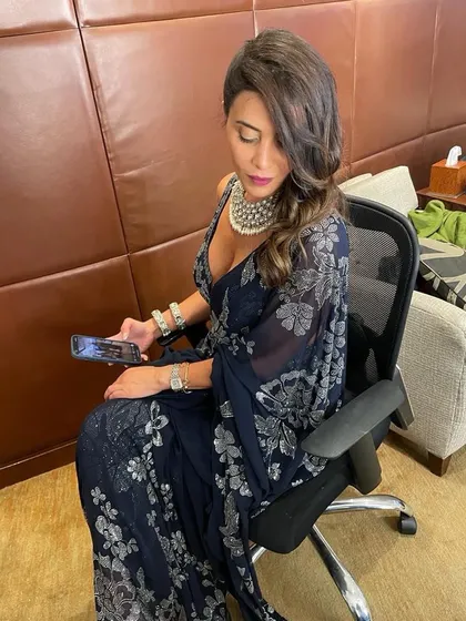 A side-swept hairstyle with voluminous waves, perfect for a glamorous evening look. This style beautifully frames the face and pairs wonderfully with statement jewelry.