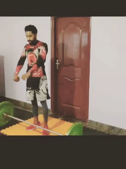 A student after completing a set of power cleans. This kind of high-intensity lifting builds the athletic base needed for MMA.