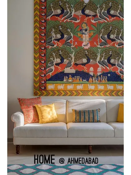 A close-up of the living area shows how we use textiles and art to add color and personality. The vibrant tapestry brings warmth and character to the otherwise neutral and elegant space.