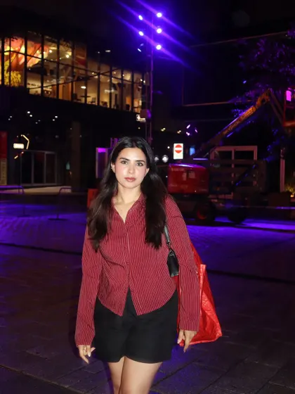 Nightlife in downtown Montréal, with the city lights creating a dramatic, moody backdrop.