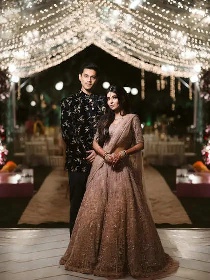 A beautiful portrait of the couple under a canopy of fairy lights. The lighting is key to creating a romantic and intimate feel for evening events, and this archway was the perfect spot.