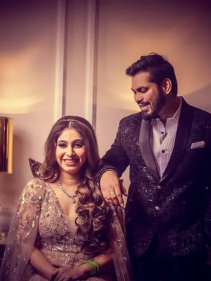 A classic, elegant portrait of an engaged couple. The warm, soft lighting creates a sophisticated and timeless feel.