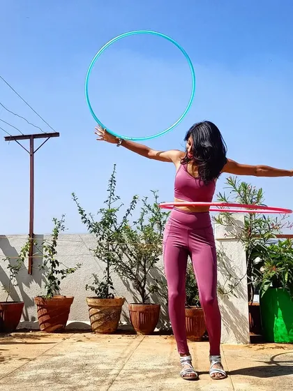 A festive Christmas-themed photo with my hoops. Celebrating the holidays with a little bit of flow and color.
