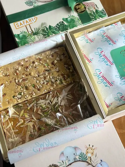 A look inside the jungle hamper, revealing the traditional Indian sweets like chana besan barfi, which we include alongside our modern bakes.