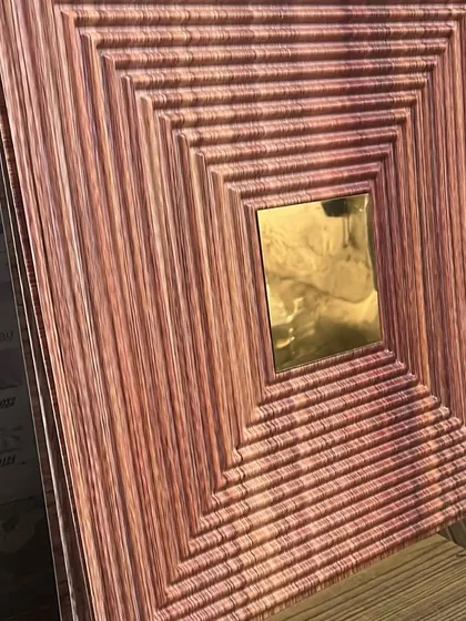 This panel combines a warm, reddish wood-grain finish with a grooved texture and a gold mirror for a rich, modern look.