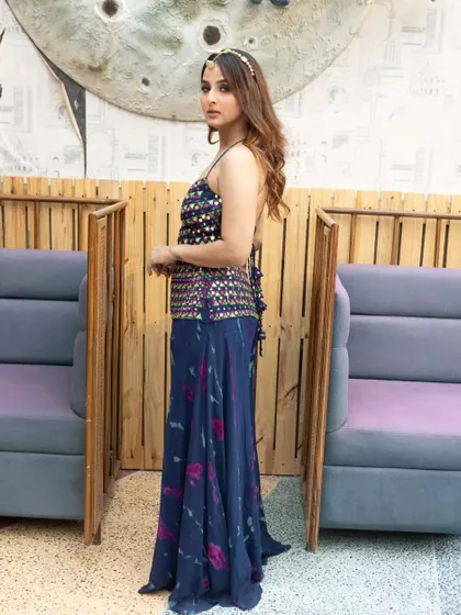 A side view, showing how the headband is styled with her loose waves.