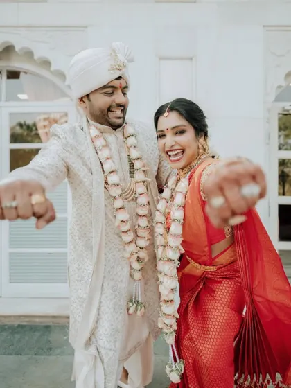 A moment of pure, infectious joy from the bride and groom after their wedding ceremony.