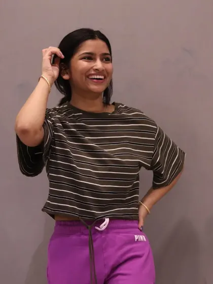 A smiling member enjoying the Bhangra class. This candid photo perfectly captures the fun and positive atmosphere we cultivate.