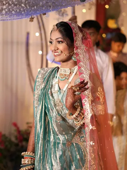 Her grand entrance. The makeup is strong enough to make a statement but soft enough to look elegant.