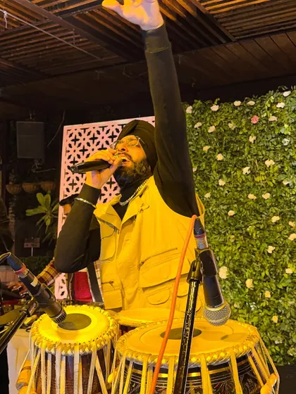 Singing a boliyan to get the crowd hyped. My performance is more than just playing instruments; it's about engaging with everyone.