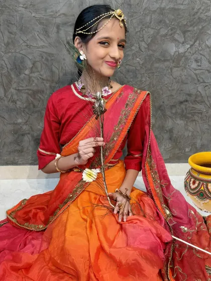 Another shot of my daughter as Radha, holding a peacock feather. The details of the drape and accessories complete the look.