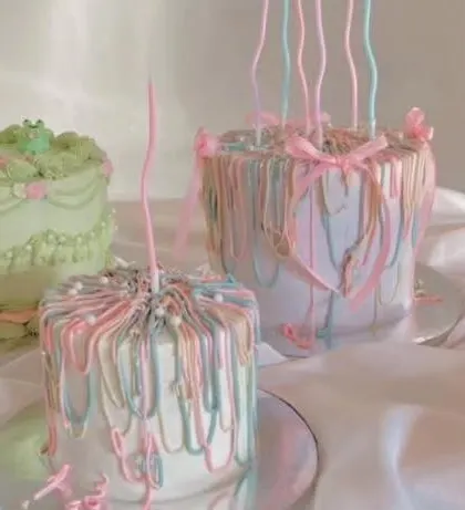 A collection of my custom-designed cakes, including the popular pastel ribbon style. I can recreate your favorite designs for any celebration.