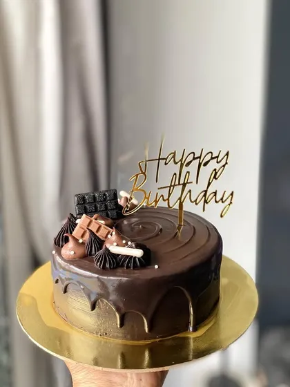 A simple yet delicious Chocolate Truffle cake. The rich, smooth ganache and minimalist decorations make it a perfect choice for any chocolate lover.