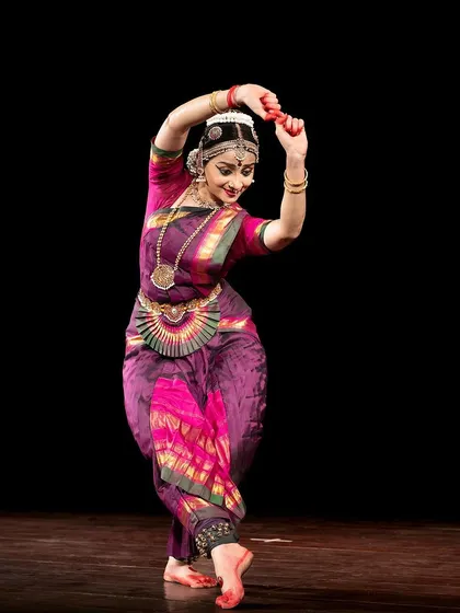 A pose from a traditional recital, where the Nayika is adorning herself, a common theme in Sringara (love) based pieces.