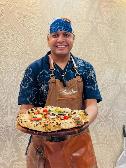 This is me in my element, ready to serve you and your guests. Whether it's for a private party or a workshop, I bring my passion for authentic, contemporary Neapolitan pizza to every event. Let's make your next gathering unforgettable.