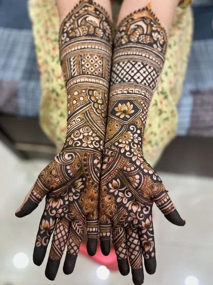 A full bridal set for bride Ayesha, featuring lotus motifs, geometric bands, and full coverage on hands and feet.