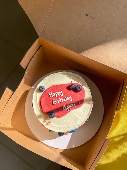 A simple and modern cake for Appa's birthday. This blueberry lemon curd cake is decorated with abstract buttercream swipes of color and fresh blueberries.