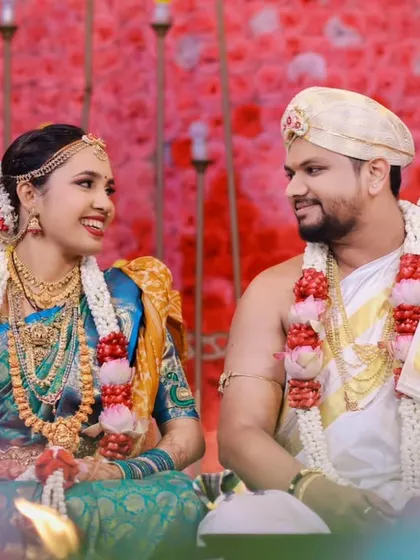 A candid photograph of the couple during their ceremony, sharing a smile that shows their deep connection.