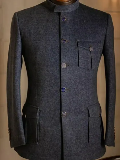 A charcoal grey Jodhpuri jacket with a modern, utilitarian design featuring flap pockets. It's a stylish and practical choice.