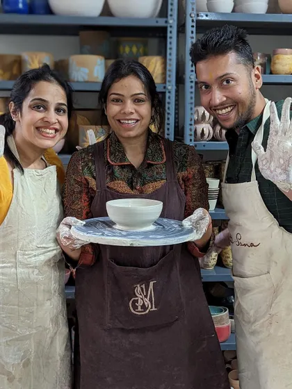 Happy faces and muddy hands after a successful pottery session. We love seeing our students proud of their work.