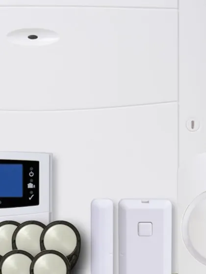 This is a look at the components of a complete wireless alarm kit. The system includes a central hub, discreet door and window sensors, and motion detectors, all designed for a clean, drill-free installation.