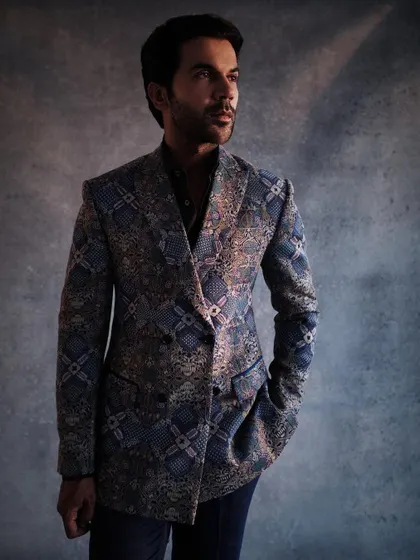 A close-up of Rajkummar Rao's custom Anamika Khanna suit. The intricate embroidery and modern cut make this a standout piece of menswear.