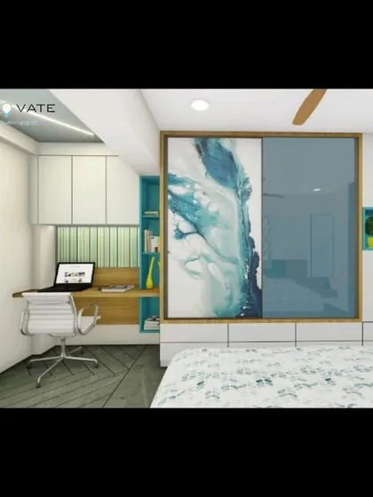 This bedroom combines work and rest with a built-in wooden desk and a sliding wardrobe featuring an abstract art panel. The design maximizes functionality in a compact space without sacrificing style.