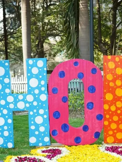 Another angle of the large HOLI letter installation on the lawn. This kind of statement piece acts as a central point for the event and a great photo backdrop.