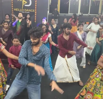 A dynamic action shot from our Dandiya night, with instructors leading the group. We bring passion and energy to every performance.